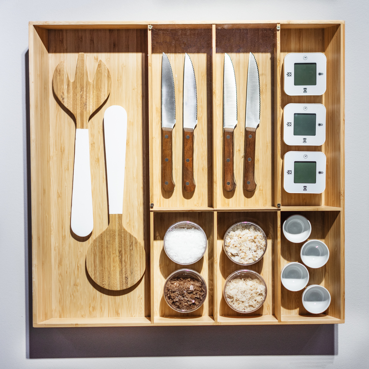 Wooden organizer box with cutlery. Modern organizer drawer for cutlery.